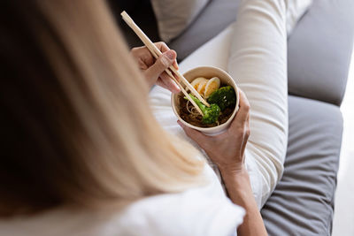 Midsection of woman holding ice cream