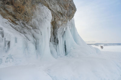 Scenic view of frozen landscape against sky