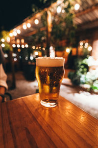 Close-up of beer glass on table