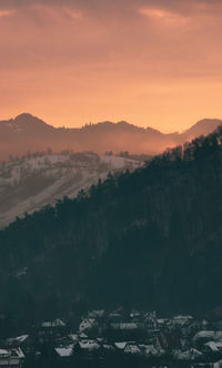 Sunset over moody mountain layers