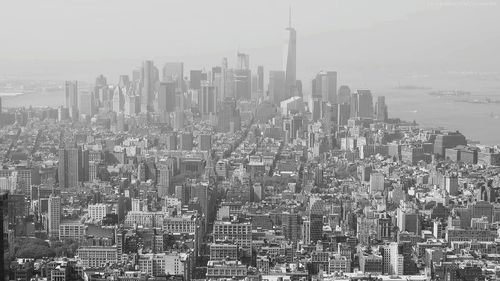 High angle view of modern buildings in city against sky