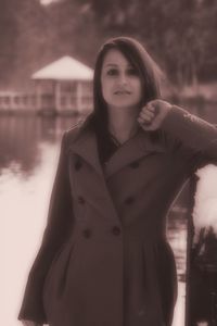 Portrait of a smiling young woman standing outdoors