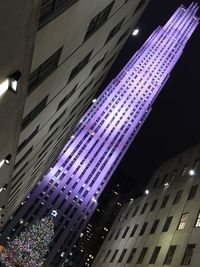 Low angle view of modern building at night