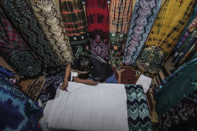 Low section of woman standing in temple