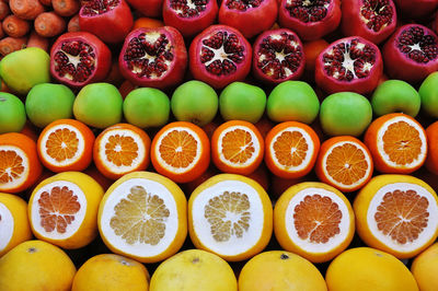 Full frame shot of orange fruits for sale in market