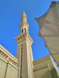 Low angle view of historical building against clear blue sky