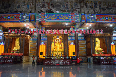 Statue in illuminated temple