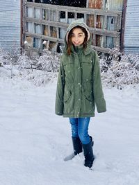 Portrait of girl standing on snow