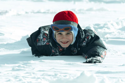 Portrait of smiling boy in snow