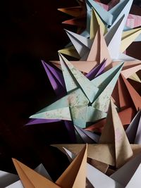 High angle view of multi colored umbrellas on paper