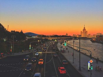 Traffic on road at sunset