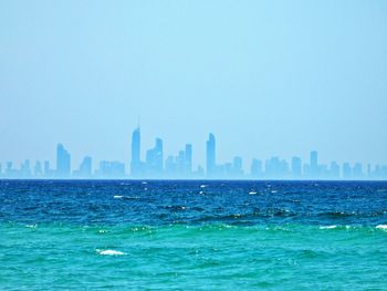Panoramic view of sea and buildings against clear sky