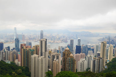 Skyscrapers against cloudy sky