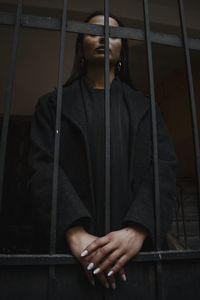 Portrait of young man standing on floor