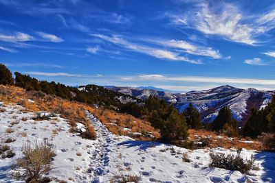 Scenic view of snowcapped mountains against sky