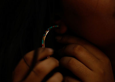 Close-up of hand holding eyeglasses