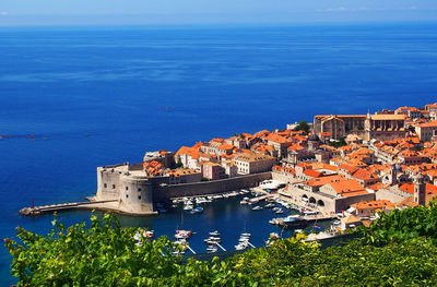 High angle view of town by sea