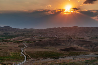 Scenic view of landscape against sky during sunset