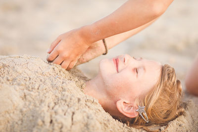 Close-up portrait of woman on rock