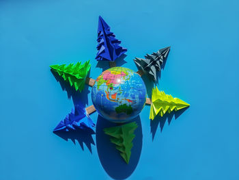 Low angle view of decoration against blue sky