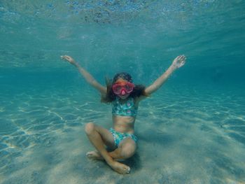 Woman swimming in sea