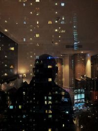 Illuminated buildings in city at night