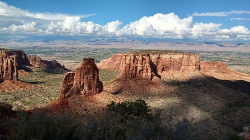 View of rock formations against cloudy sky