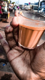 Close-up of hand holding drink