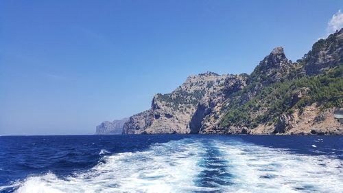 Scenic view of sea against clear blue sky