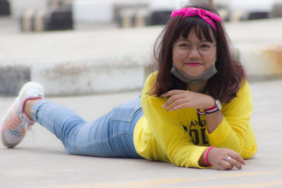 Portrait of girl sitting outdoors