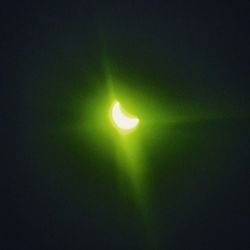 Low angle view of moon in the dark