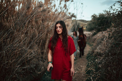 Young woman standing on field