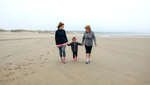 Family walking at beach
