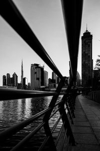 Bridge over river with buildings in background
