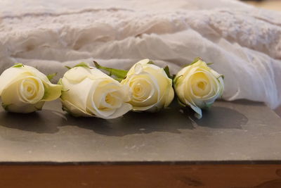 Close-up of rose bouquet on white table