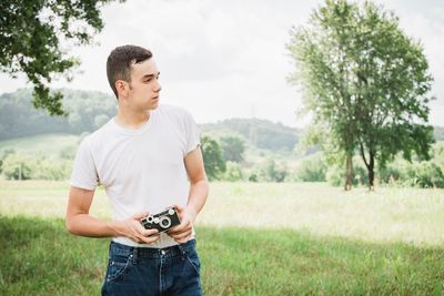 Full length of young man looking at camera