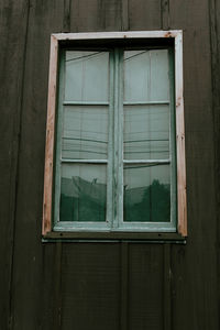 Low angle view of window of old building