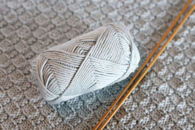 High angle view of hat on rug against gray background