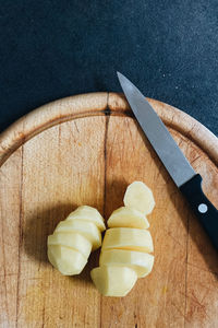 High angle view of chopped potatoe on cutting board
