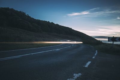 Country road leading towards mountains