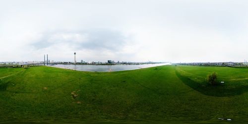 Scenic view of farm against sky