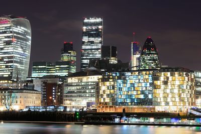 Skyscrapers lit up at night in city