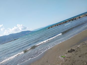 Scenic view of beach against sky