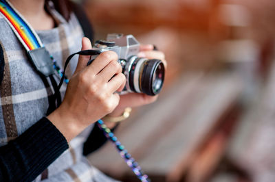 Close-up of hand holding camera