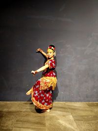 Woman standing in traditional clothing