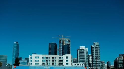 Modern buildings against blue sky