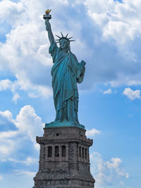 Low angle view of statue against cloudy sky