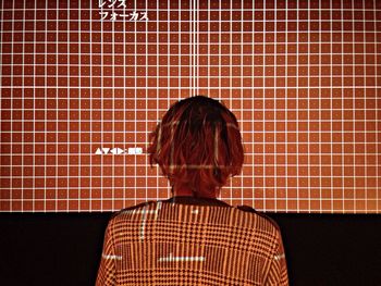 Close-up of woman standing against white background