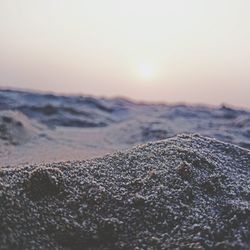 Scenic view of beach against sky during sunset