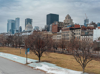 Buildings in city against sky